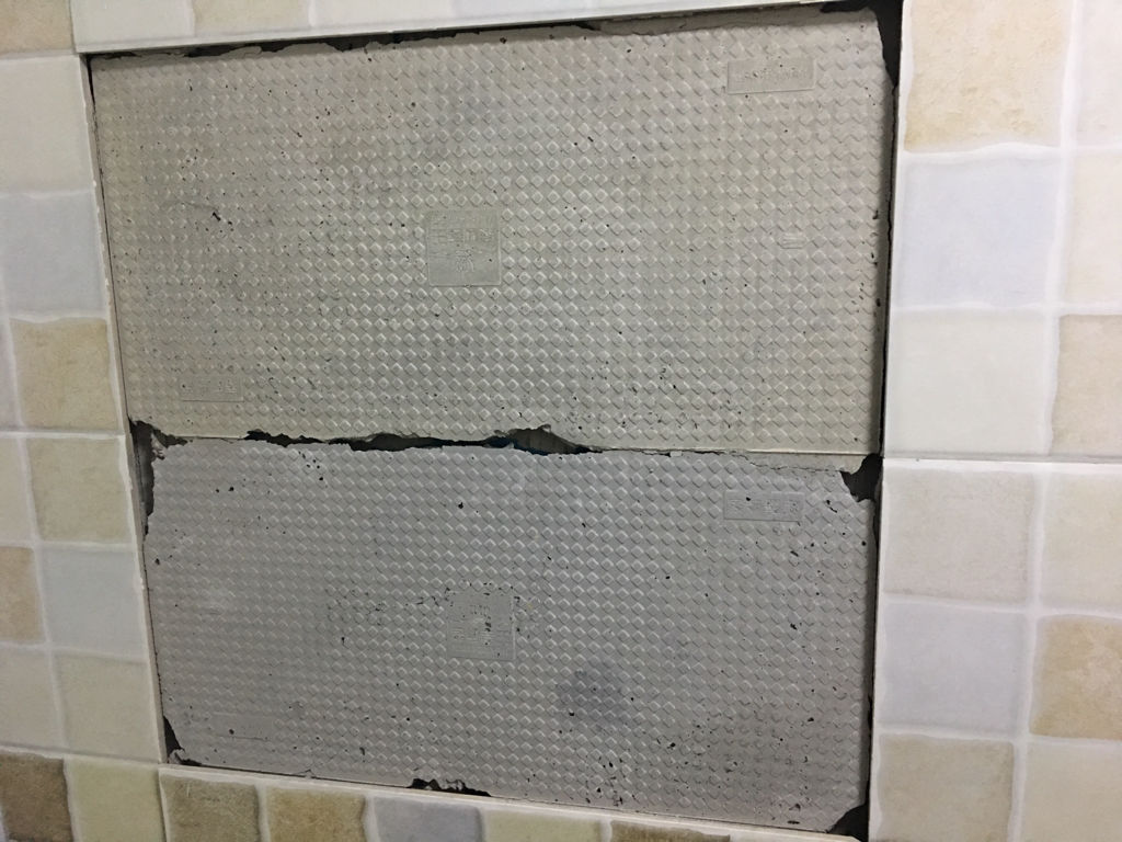 墙砖空鼓怎么处理的视频教程图片(针对近两年墙砖空鼓的现象的维修方法)